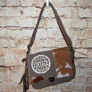 Vintage Stamp upcycled canvas and cow hide messenger bag